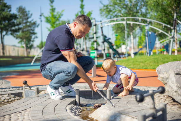 istock Father and son together in park 1329642786