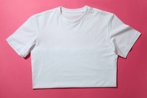 istock White t-shirt on pink background, space for text 1329642820