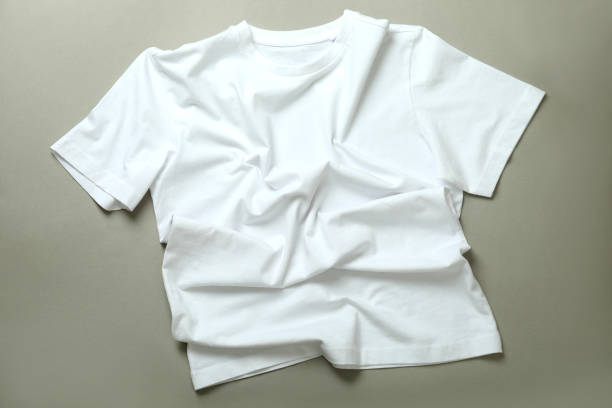 istock Blank white t-shirt on gray background, top view 1329642852