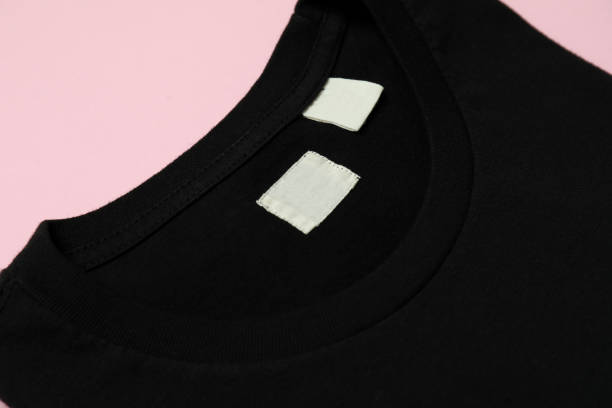 istock Black sweatshirt on pink background, close up 1329643674