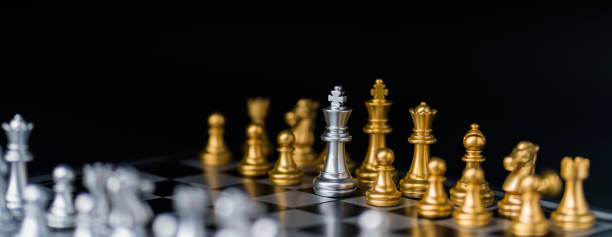 istock chess board game in competition play, Ideas business success concept 1329644107