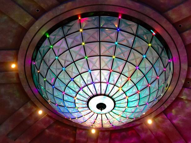 istock Colorful light fixture in a hall ceiling 1329644259