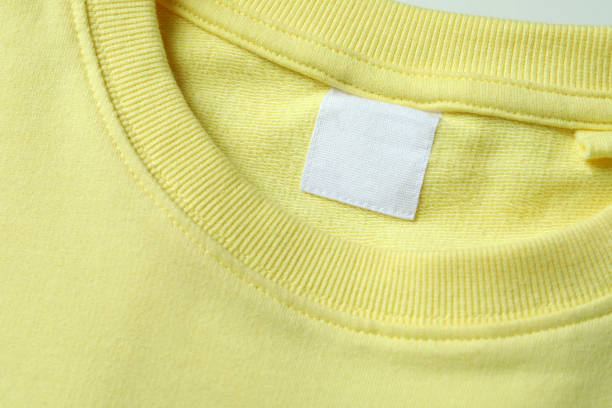 istock Yellow sweatshirt with blank label, close up 1329644263