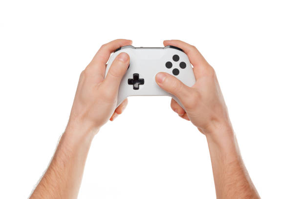 kontroler konsoli do gier wideo w rękach graczy izolowany na białym tle - video game gamepad black isolated on white zdjęcia i obrazy z banku zdjęć