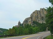 istock Scenic winding road with beautiful rock formations at Blackhills, South Dakota. 1329645497