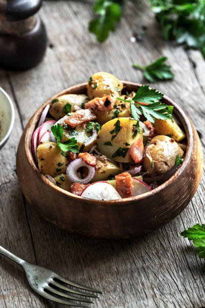 potato with bacon,radish salad in a wooden bowl - skink och potatissallad bildbanksfoton och bilder