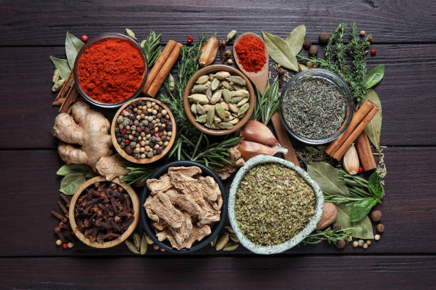 istock Different natural spices and herbs on wooden table, flat lay 1329645803