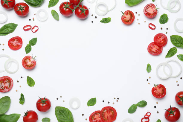istock Frame made of fresh basil leaves and vegetables on white background, top view. Space for text 1329649211