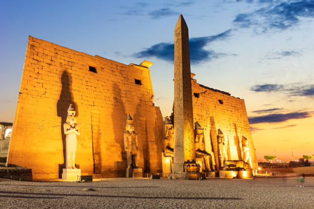 istock Pylon with obelisk in Luxor Temple, beautiful evening view, Egypt 1329651125