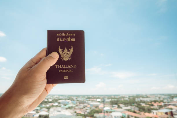 istock Passport in Thailand, isolated on the sky background 1329651235