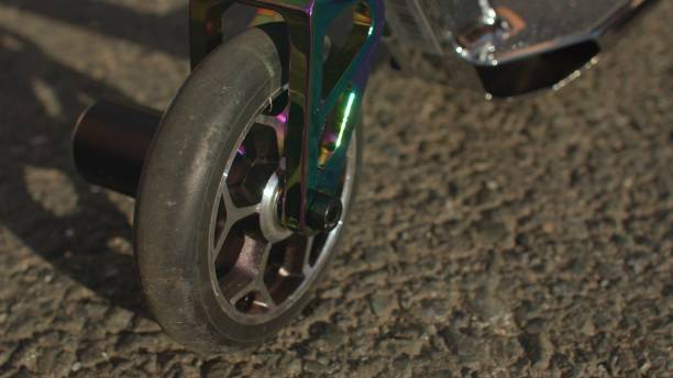 istock Scooter wheel on road. It moving, ready start mover disk mounted rotating axis 1329651372