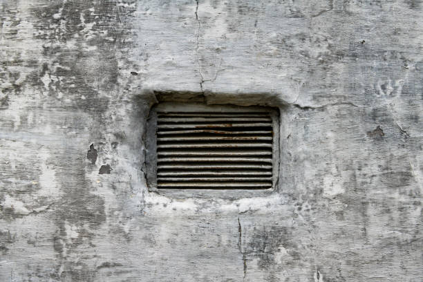 istock ventilation grille and abstract gray painted old wall for background or texture, peeling paint and stucco with cracks like grunge style 1329655388