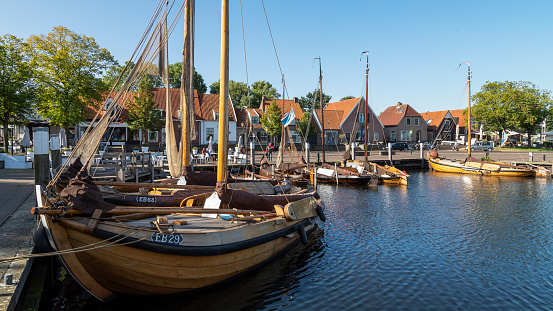 Elburg, The Netherlands, April 19, 2021; view of the harbor with traditional wooden fishing boats.