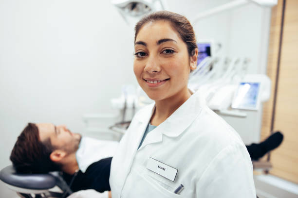 istock Female dental expert in her clinic 1329657214
