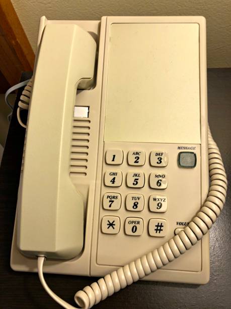 istock Cream-colored telephone, close up, cropped shot 1329658534