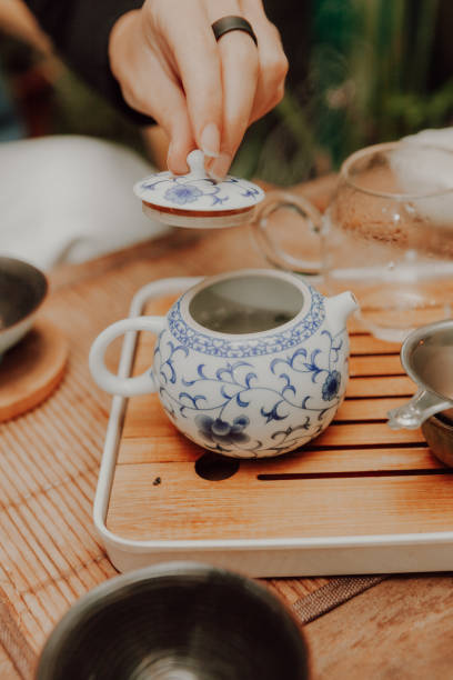 istock Woman serving Chinese tea in a tea ceremony 1329658687