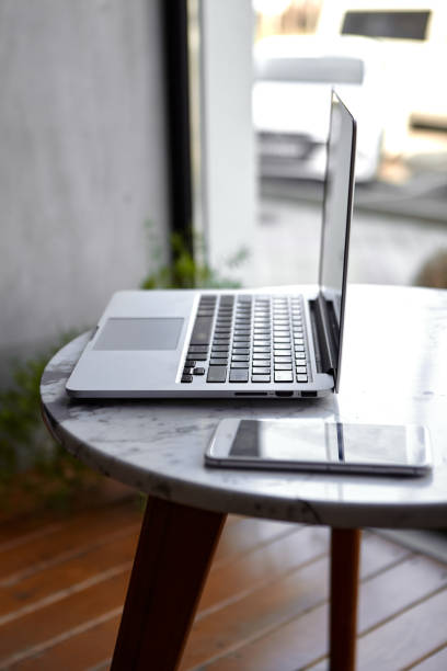 istock Laptop with phone home office 1329659299