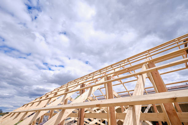 istock House under construction timber frame for a progressing house. Wooden roof in a building being built. Version 2 1329659341