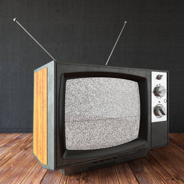 istock Old Retro TV with Blank Screen Against Black Wall 1329659995