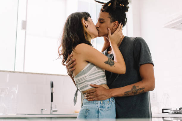 istock Romantic couple kissing indoors 1329660815