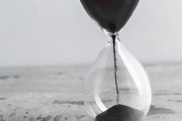 istock Close up hourglass on table 1329660835