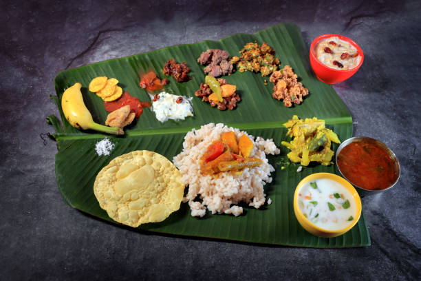 onam sadhya -traditional kerala food and Culture Onam banquet or onam sadhya ,Vishu sadhya- traditional kerala food and Culture bantam stock pictures, royalty-free photos & images