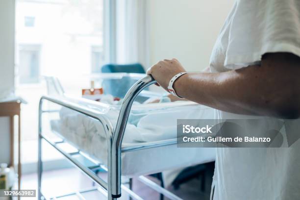 Woman In Hospital With Her Baby Stock Photo - Download Image Now - Hospital Nursery, Pregnant, Hospital
