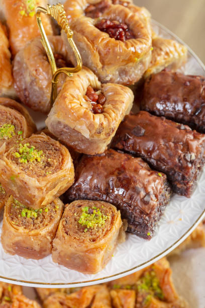 istock Assorted baklava- A Turkish sweet arranged on a decorative plate. Middle eastern food photography. 1329664164
