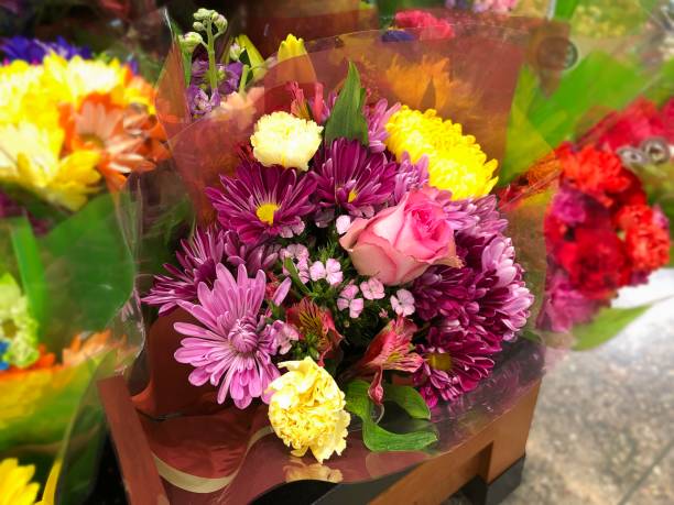 istock Assorted flowers in a bouquet wrapped in plastic 1329666477