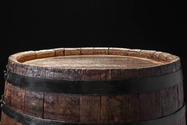 old wooden barrel on a dark background - furniture table isolated old imagens e fotografias de stock