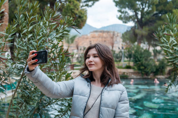 istock Young woman making a selfie with smartphone 1329667966