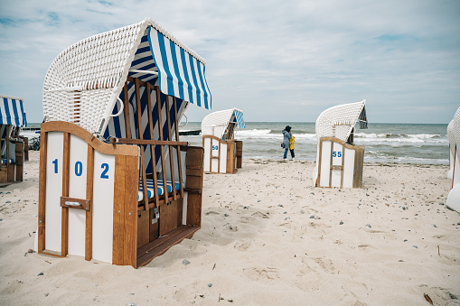 view on empty beach chairs at sand beach of the baltic sea