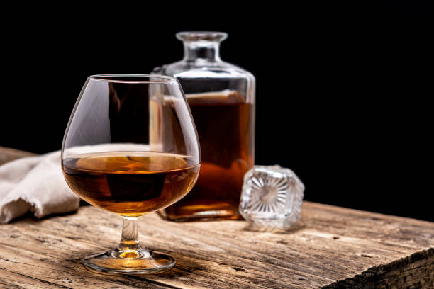 istock Cognac drink on wooden table 1329671288