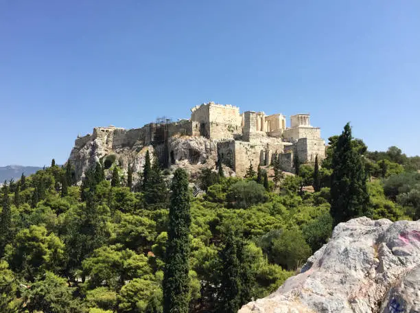 Photo of View of the Parthenon on the Athenian Acropolis seen from the Areopagus Hill in Athens, Greece.