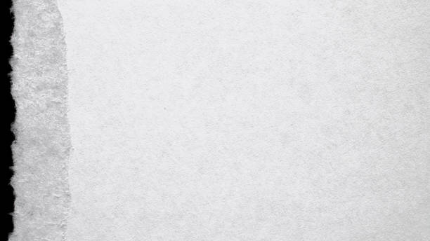 istock Torn open paper. Abstract rip vintage sheet frame. Old white torn paper texture isolated on black background. Crumpled backdrop surface placard with space for text. 1329674465