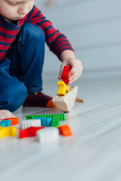 istock Kid Playing With Toys 1329675684