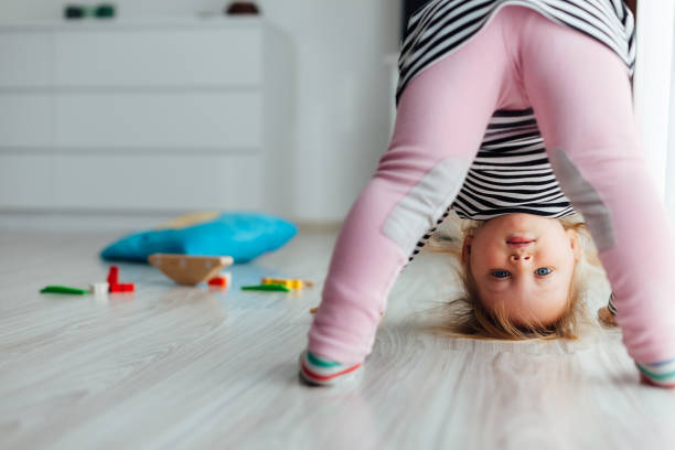 istock Girl Doing Exercises On The Floor 1329675737