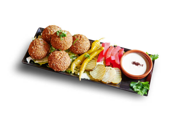 istock Black plate with Falafel apetizer isolated 1329677199