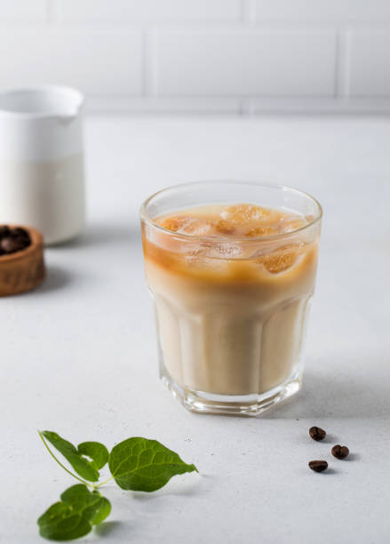 istock Cold coffee with ice and cream on a white background. Homemade cold latte. 1329678645
