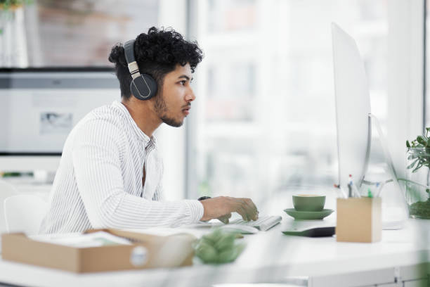 istock Shot of a young businessman working on a computer in an office 1329679312