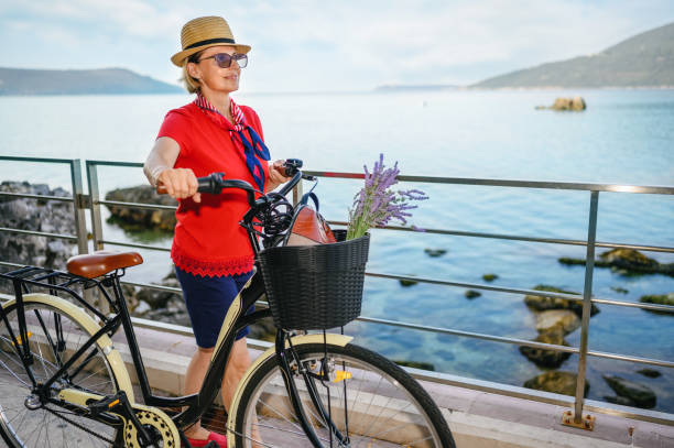 istock Mature woman riding a bicycle 1329679865