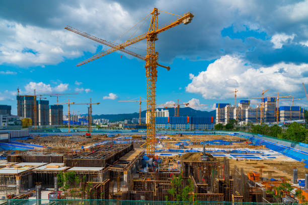 istock Tower Crane and building modern under construction against blue sky at south korea 1329681777