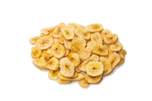 istock Banana chips isolated on a white background. Dehydrated banana. 1329681846