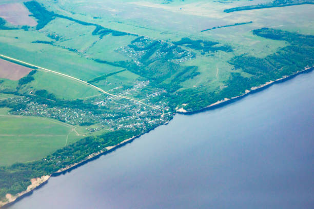 istock View from airplane on Earth surface - river. the Volga River 1329685510