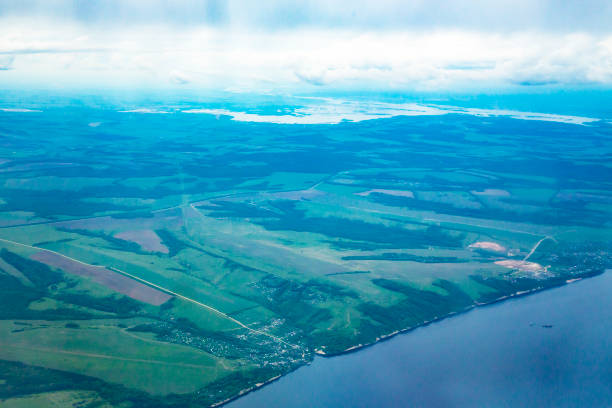 istock View from airplane on Earth surface - river. the Volga River 1329685527