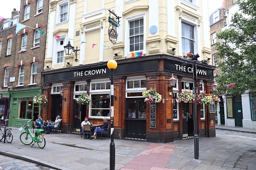 People visit The Crown pub in Soho area of London. It is a typical London pub. There are more than 7,000 pubs in London.