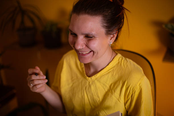 istock cheerful dedicated hard working woman, working late at her home office 1329687425