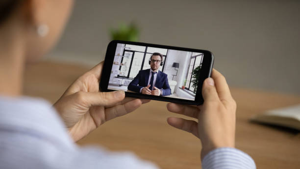 istock Young woman holding mobile video call conversation. 1329690274