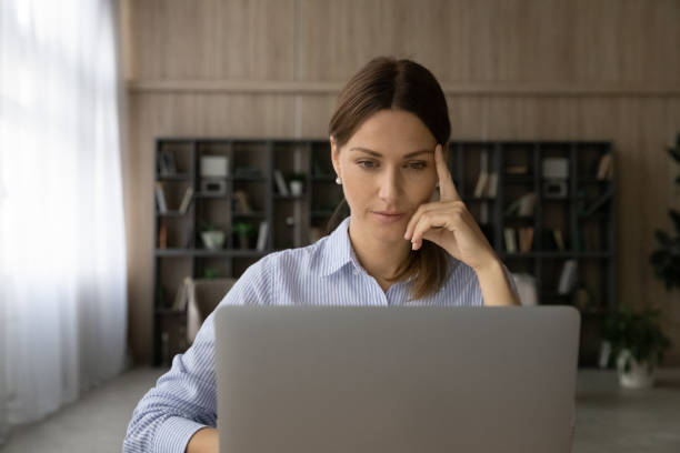 istock Concentrated thoughtful young business lady working on computer. 1329690275