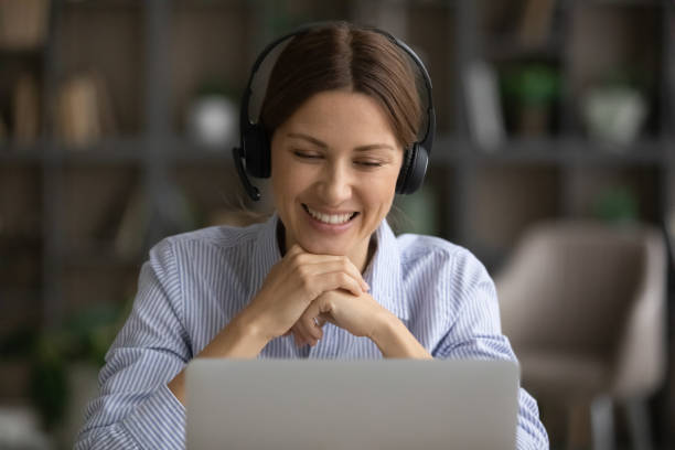 istock Smiling young business lady holding video call conversation. 1329690572